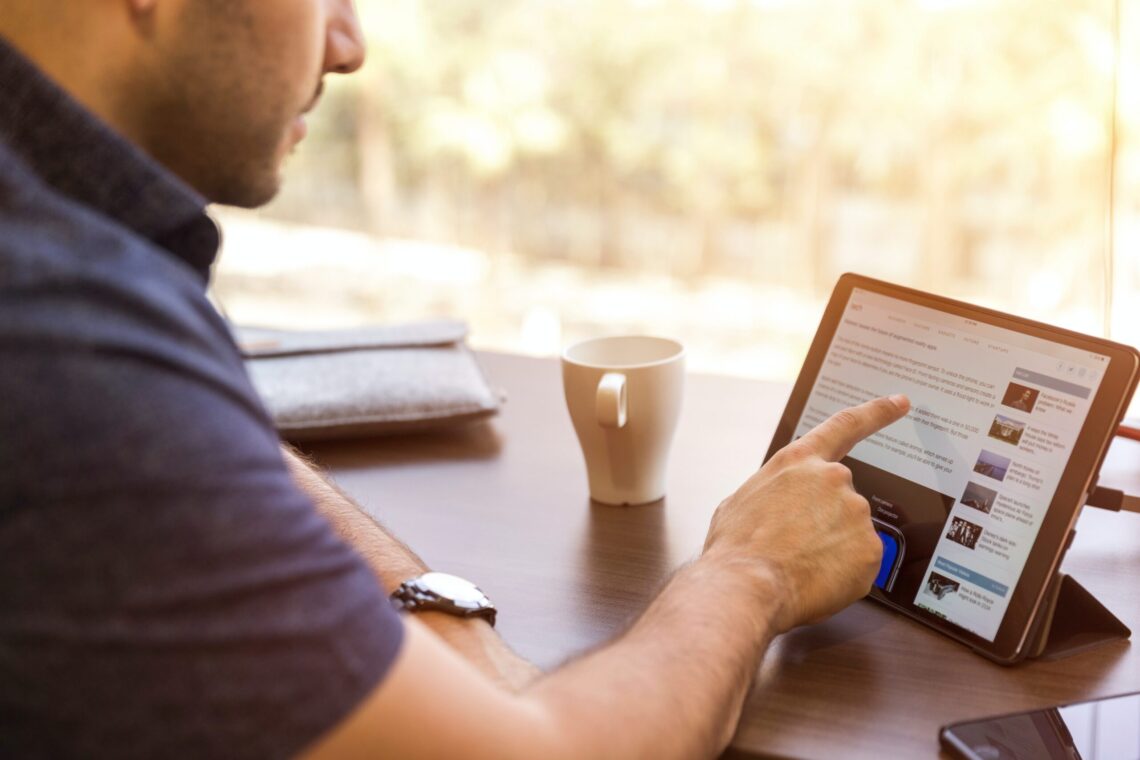 Man looks into improving his LinkedIn profile