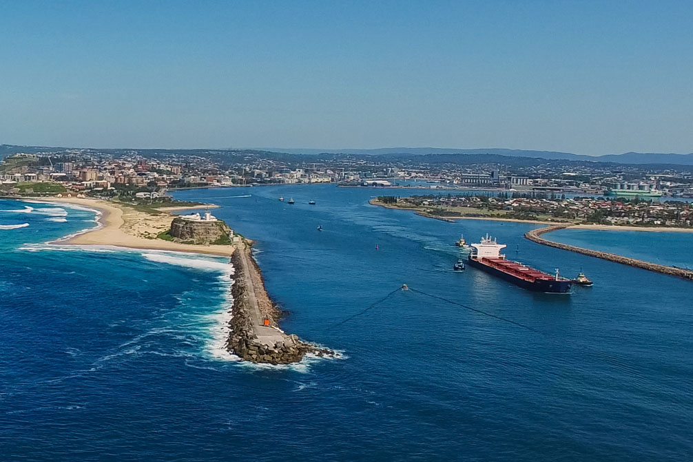 Picture of Newcastle with a coal ship leaving the harbour