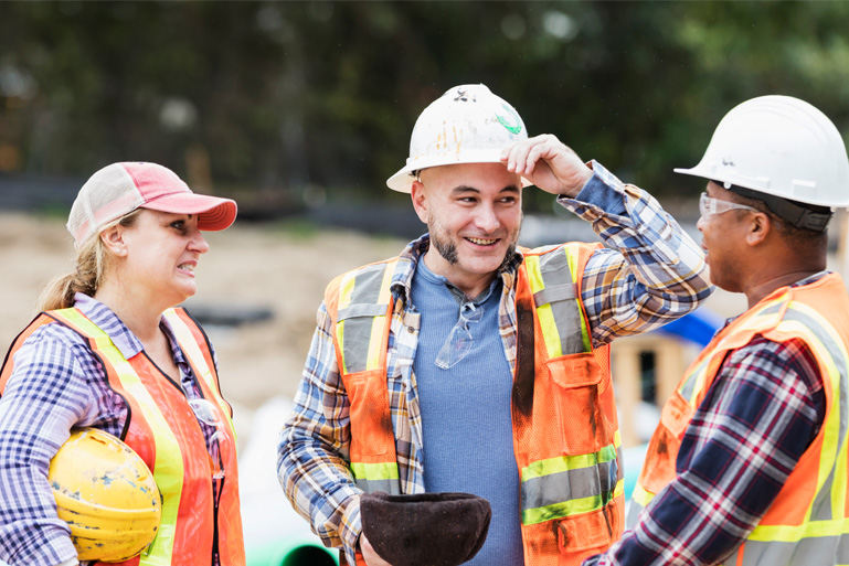 Women and two men working in construction