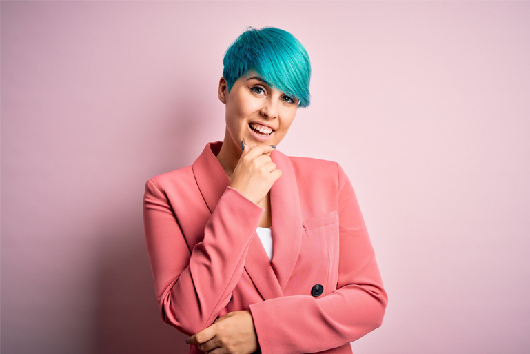 Business women with green hair and pink jacket