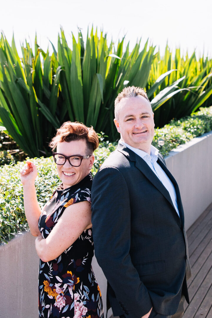 Imsge of Verve Partners Recruitment, CEO Clare Ferguson and Executive Simon Rutten, Smiling on rooftop balcony overlooking honeysuckle Foreshore