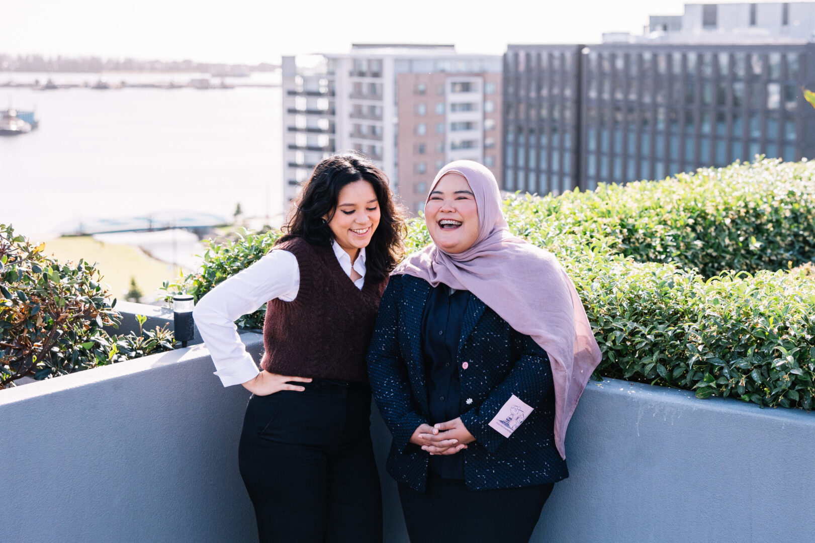 Verve Partners Recruitment Employees posing on Newcastle Rooftop Overlooking Honeysuckle Foreshore