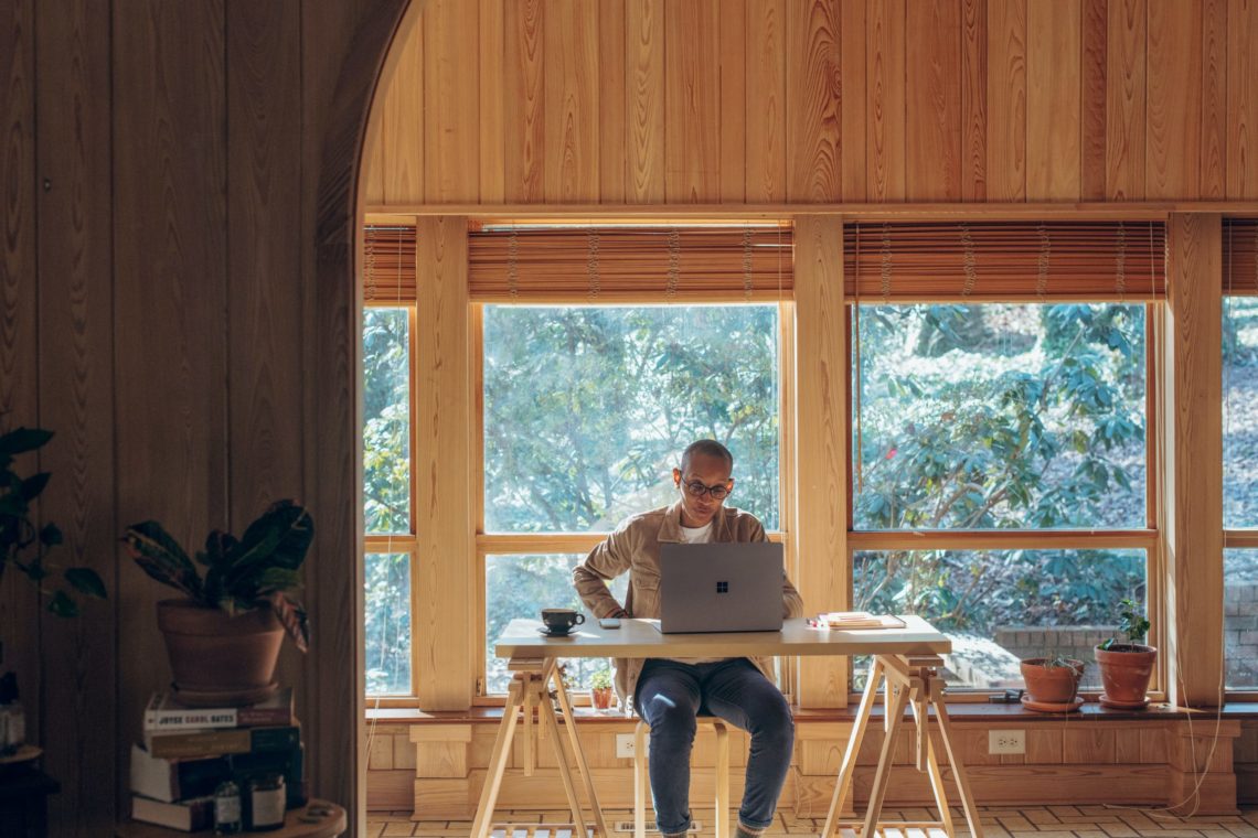 Man reading about DiSC styles and working from home