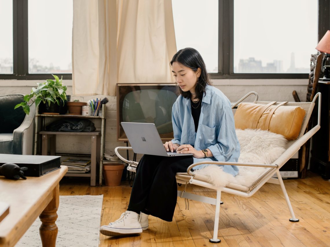 Lady sitting on a chair crafting her follow-up email