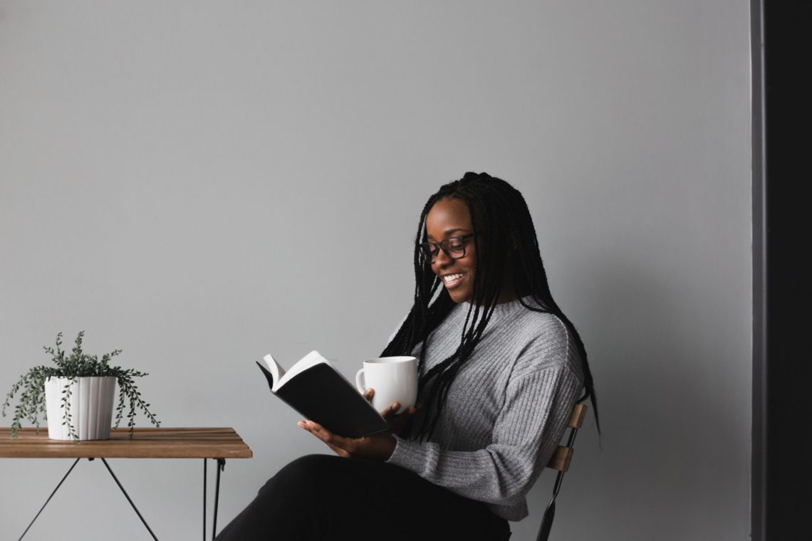 Woman reads one of the 4 must-read business books
