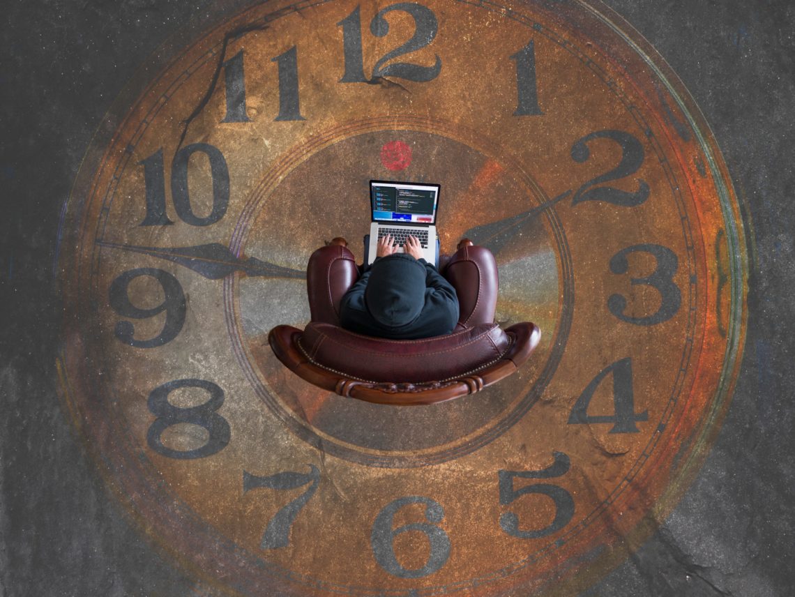 Person in an abstact clock researching when is the best time of year to look for a job