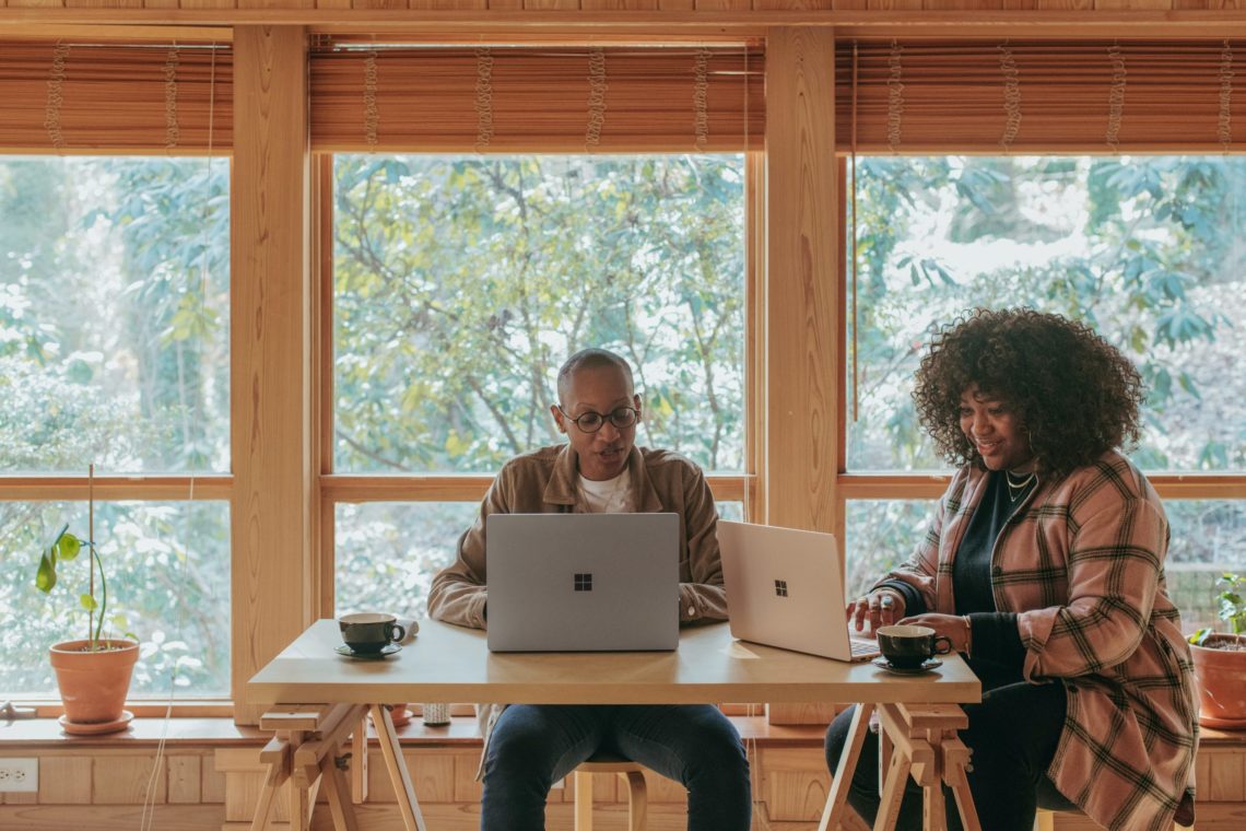 Two colleagues ensuring they reduce hiring bias